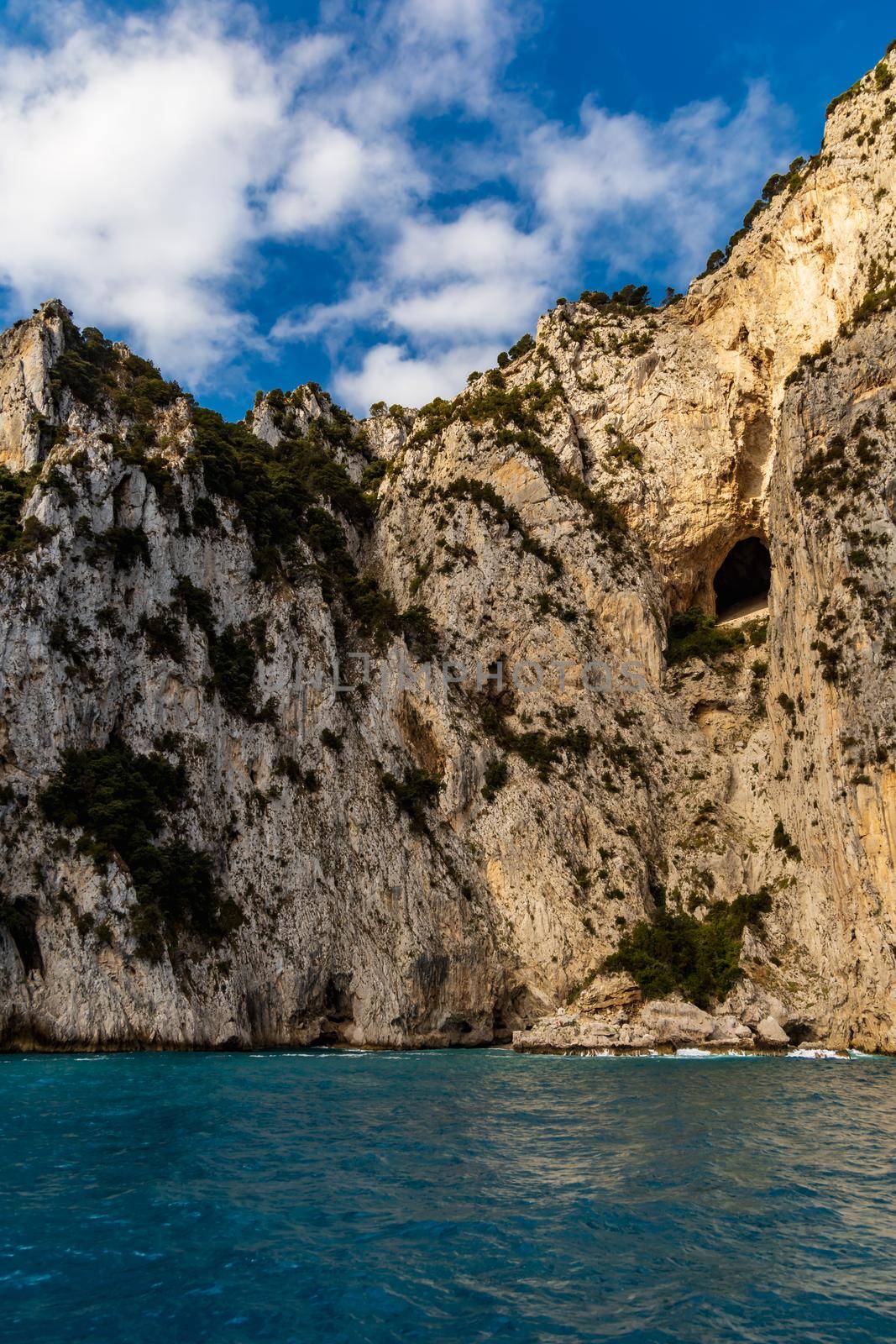 Edge of high cliff next to the sea at sunny day on Capri island