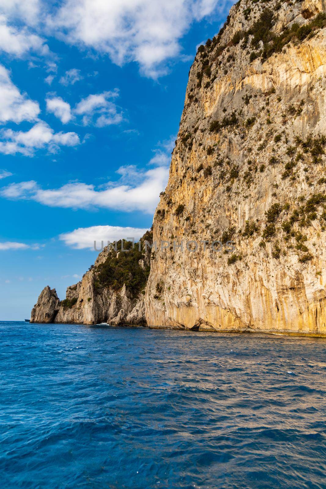 Edge of high cliff next to the sea at sunny day on Capri island