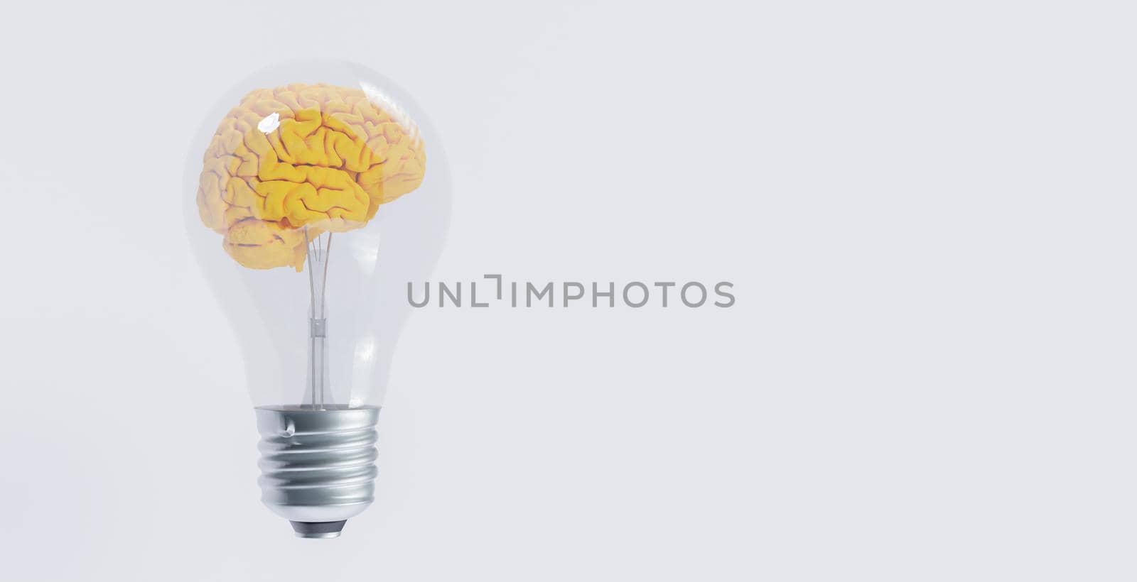 light bulb with yellow brain inside it by asolano