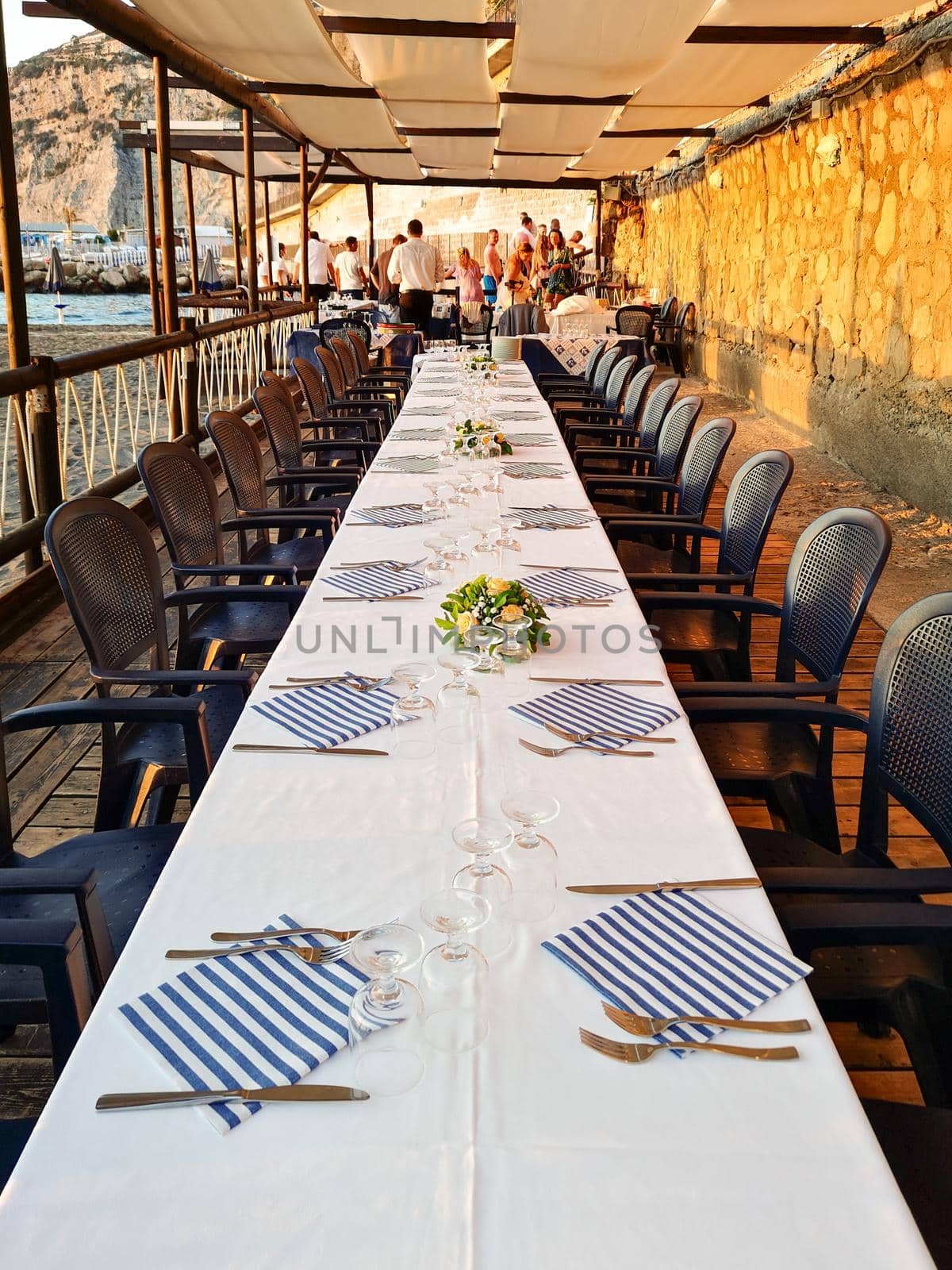 White and blue decorations on wedding table at outdoor wedding