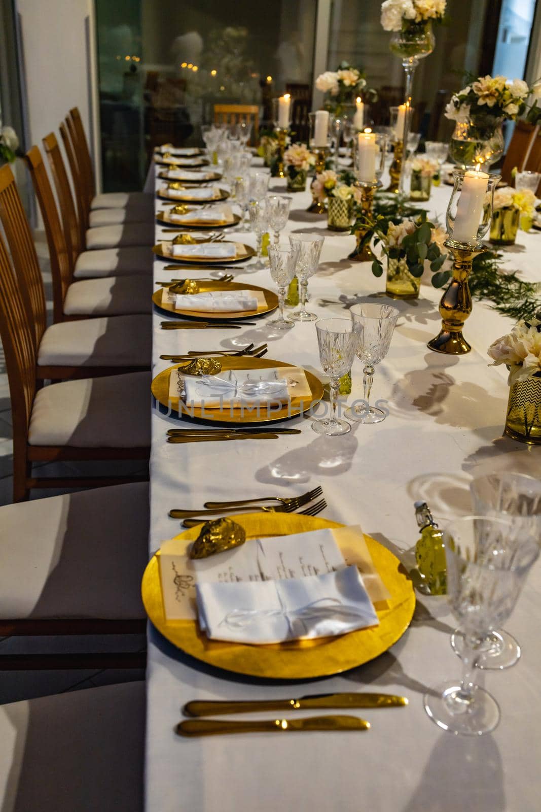 White green and golden decorations on wedding table at outdoor wedding