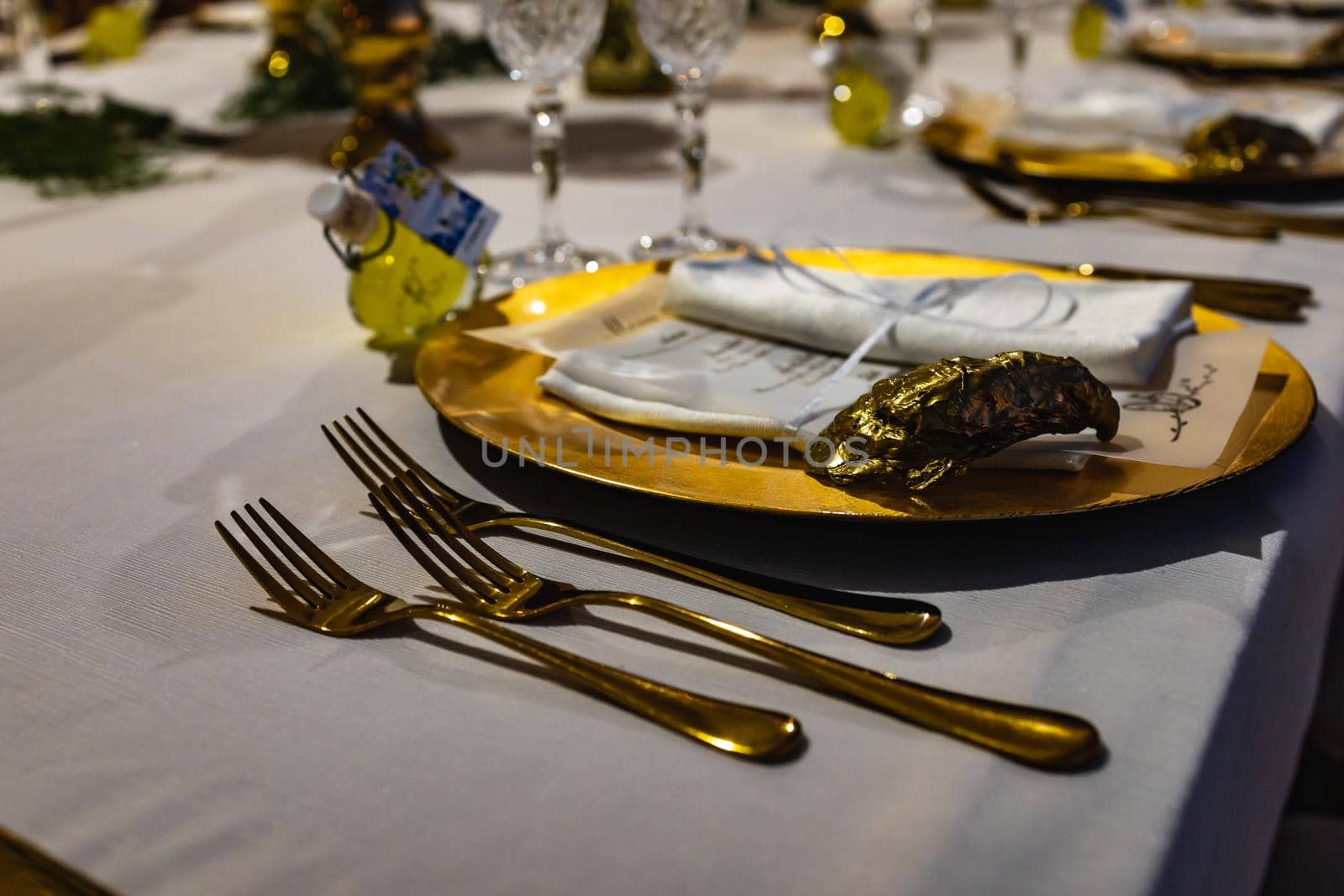 White green and golden decorations on wedding table at outdoor wedding