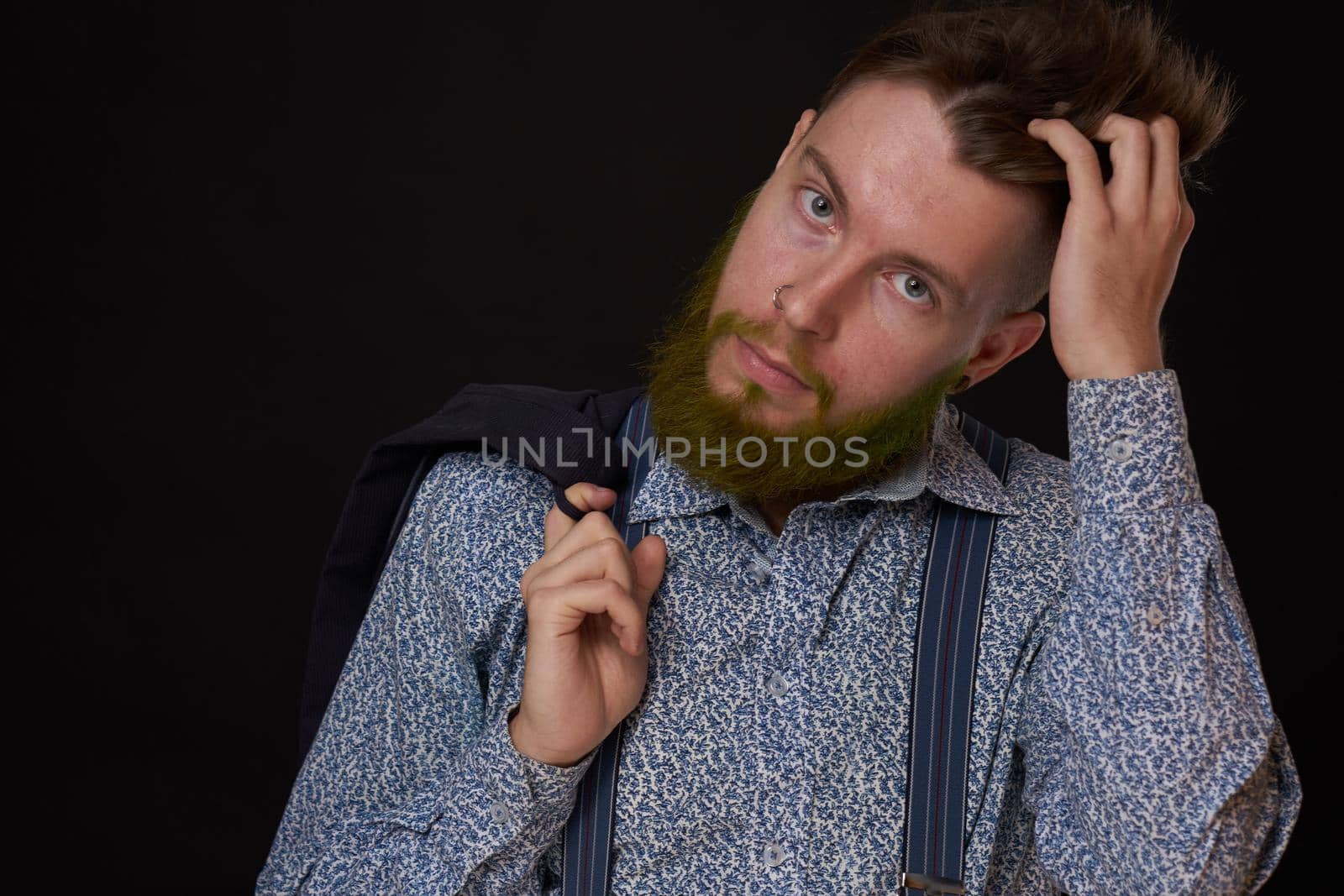 business man in shirt with jacket over his shoulders posing self confidence. High quality photo