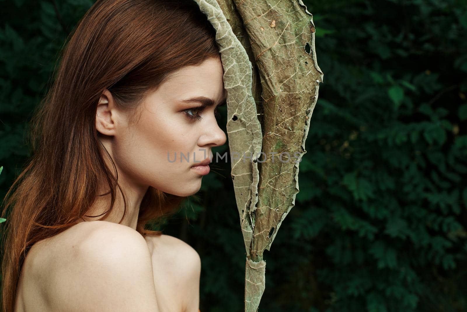 portrait of a woman in a field outdoors bare shoulders clear skin Lifestyle. High quality photo