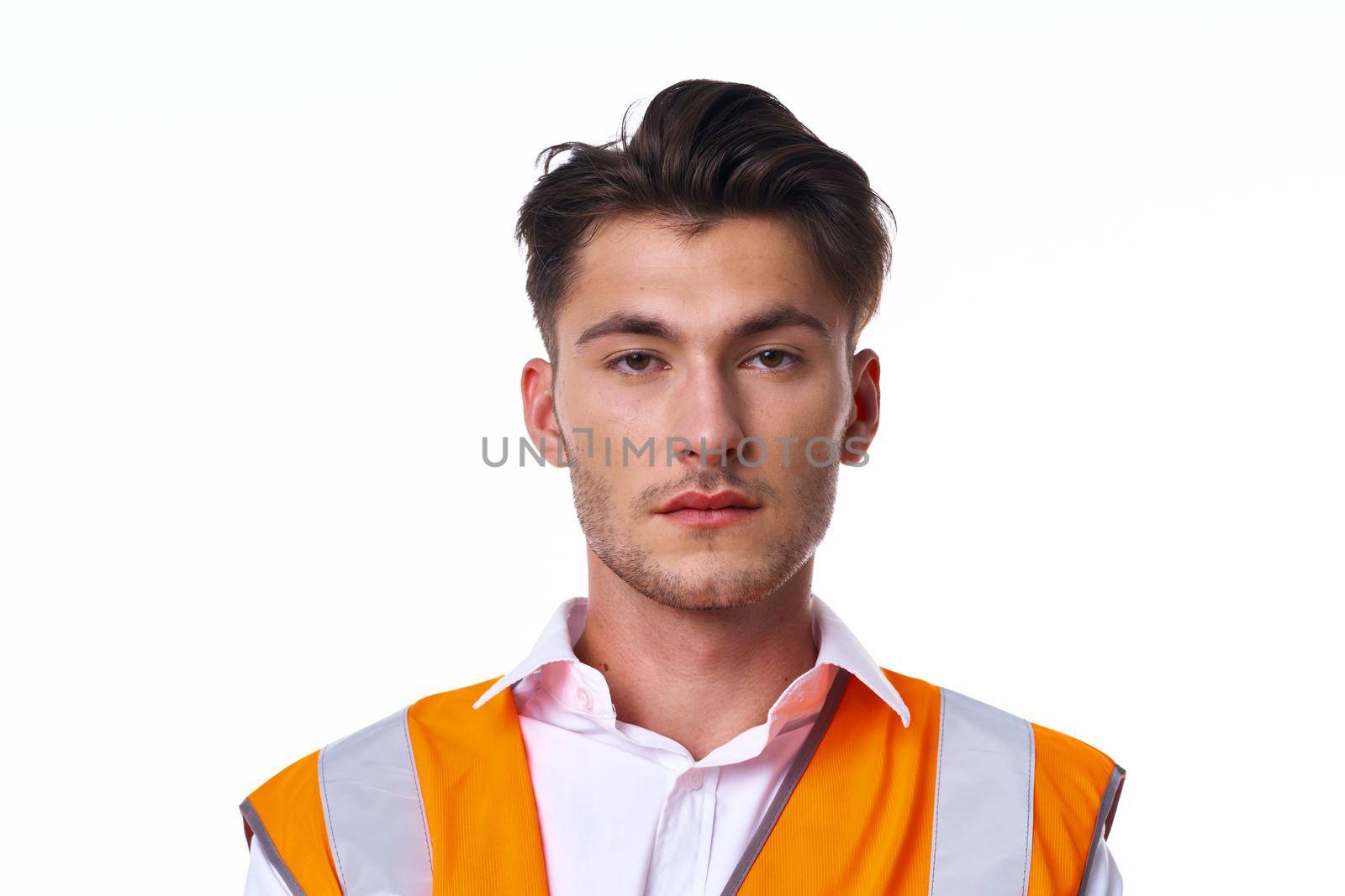 engineer in orange vest posing job professional. High quality photo