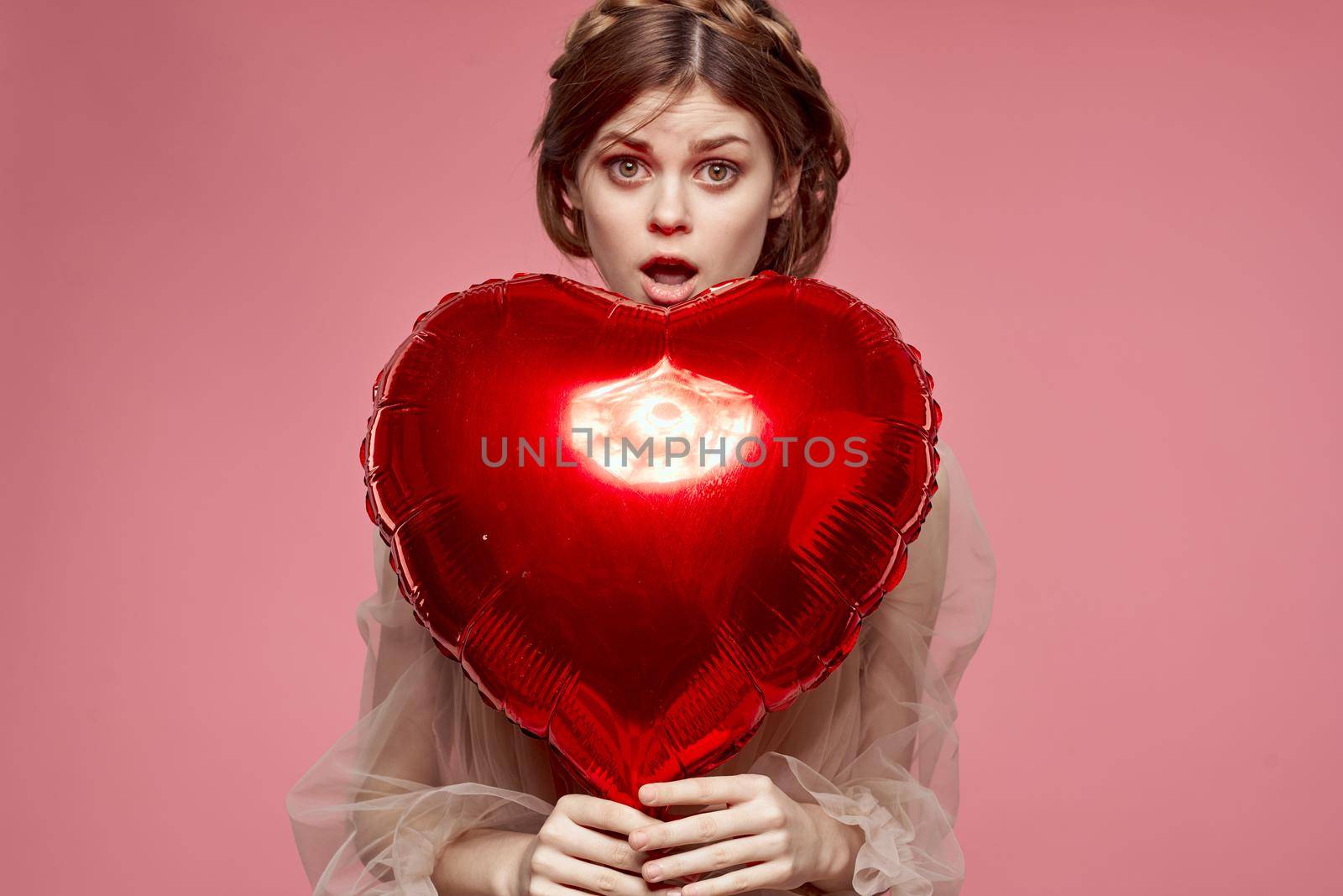 portrait of a woman in a dress balloon Valentine's Day model studio. High quality photo