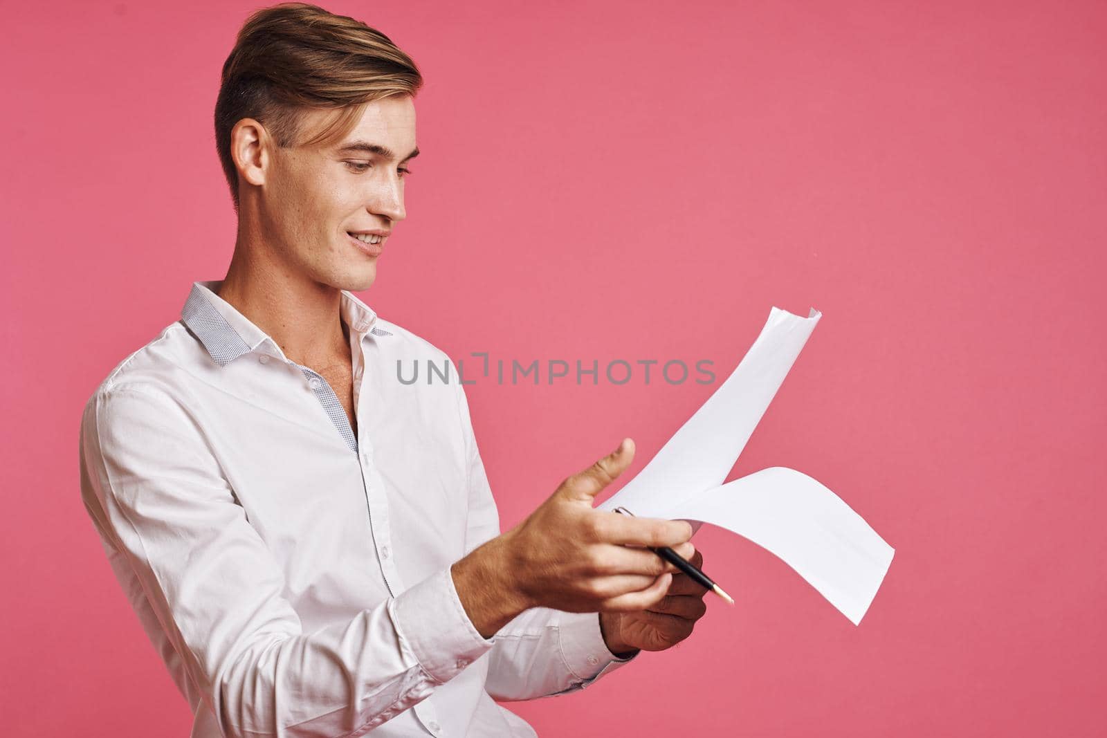 portrait of a man reading documents in hand isolated background. High quality photo