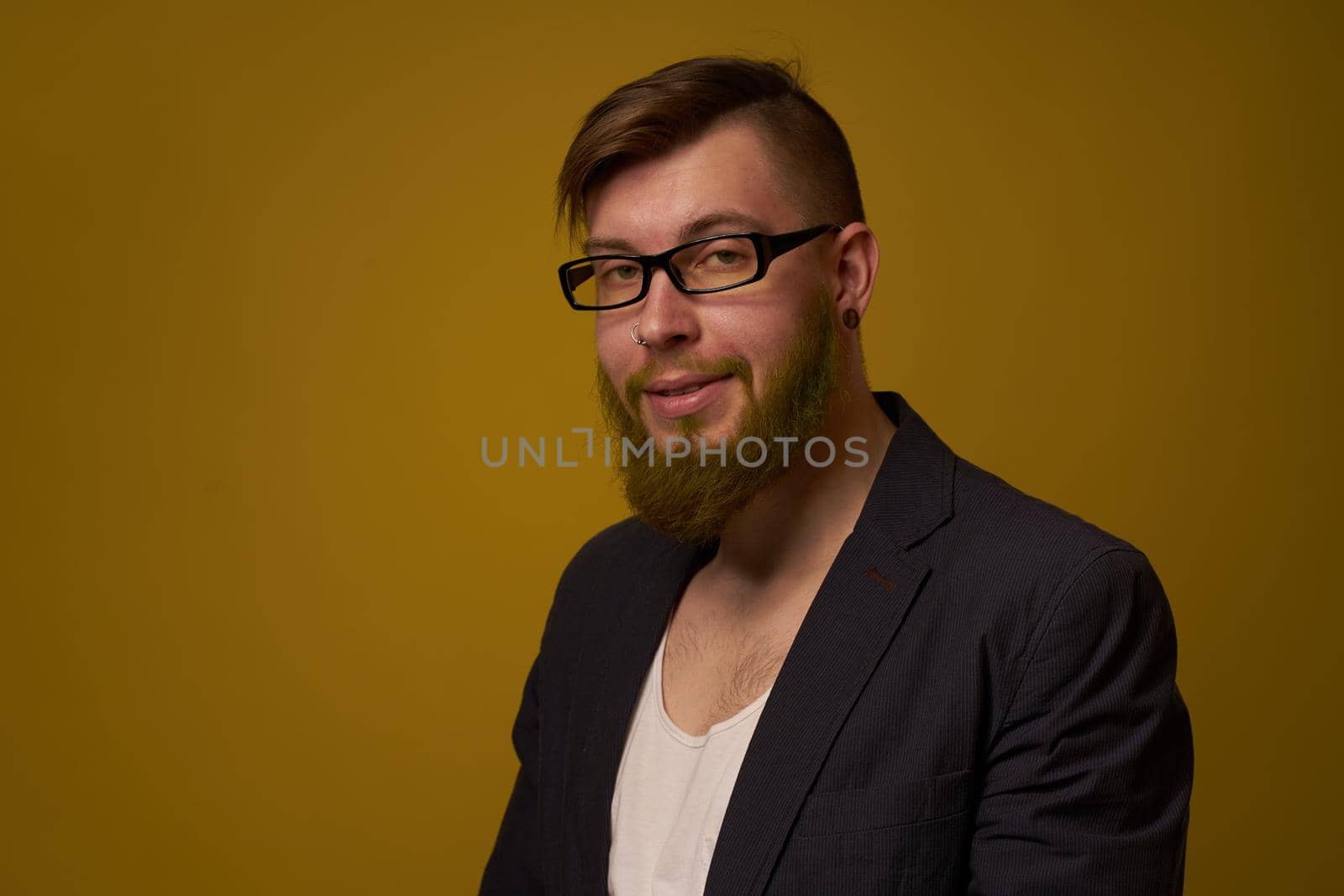 bearded man in a black jacket with a book in his hands education. High quality photo