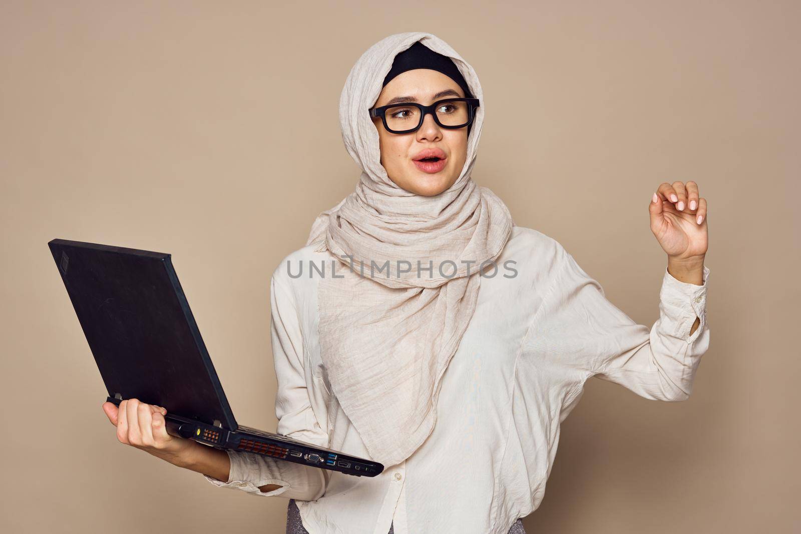 muslim woman with laptop work learning technology. High quality photo