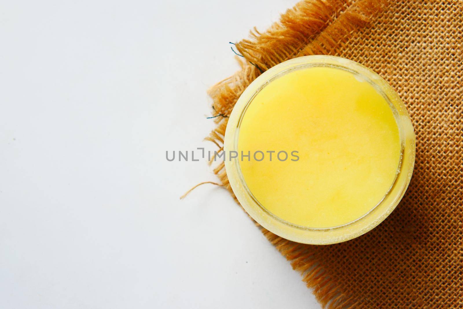 homemade ghee in container on a table