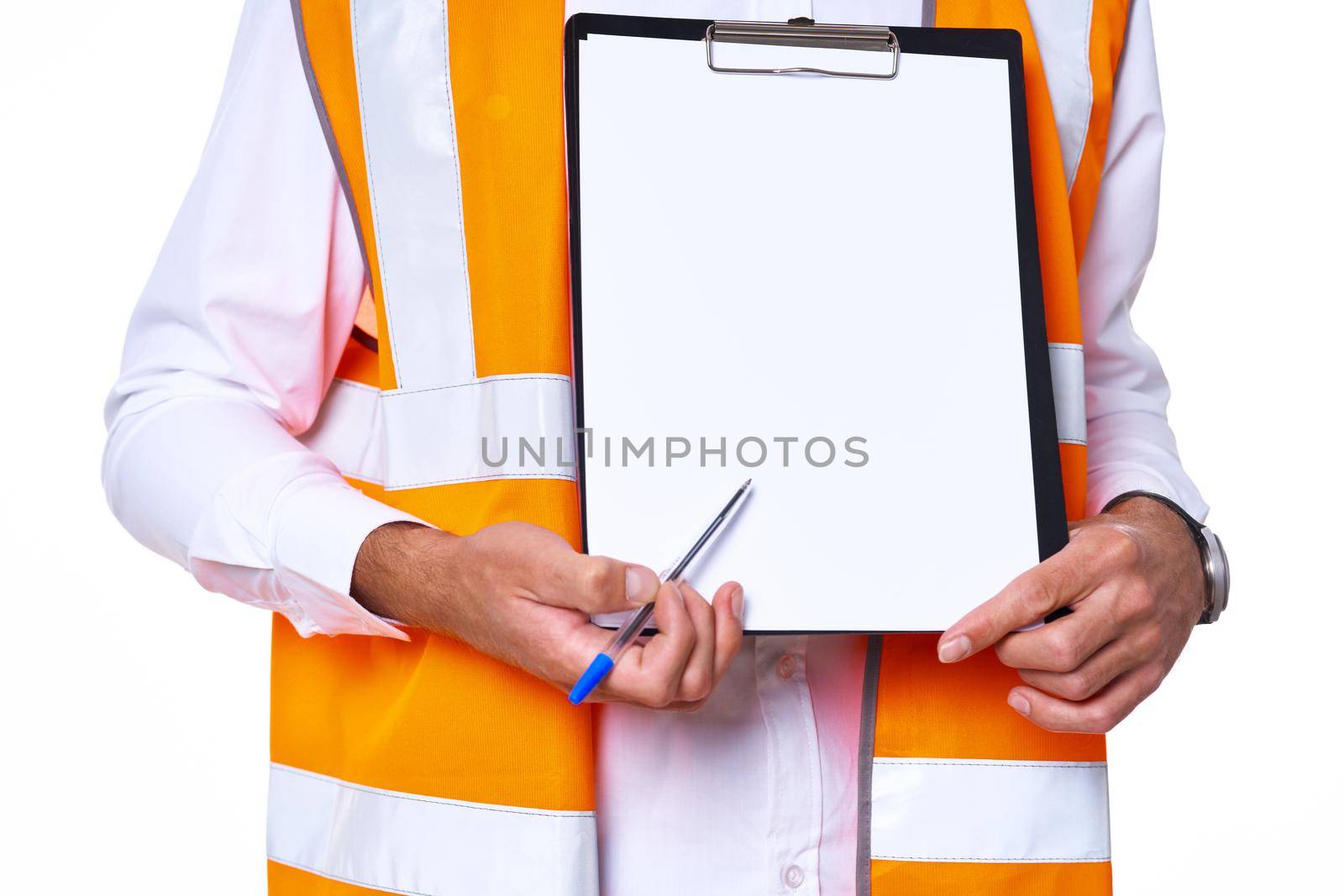 working man in orange uniform posing construction. High quality photo