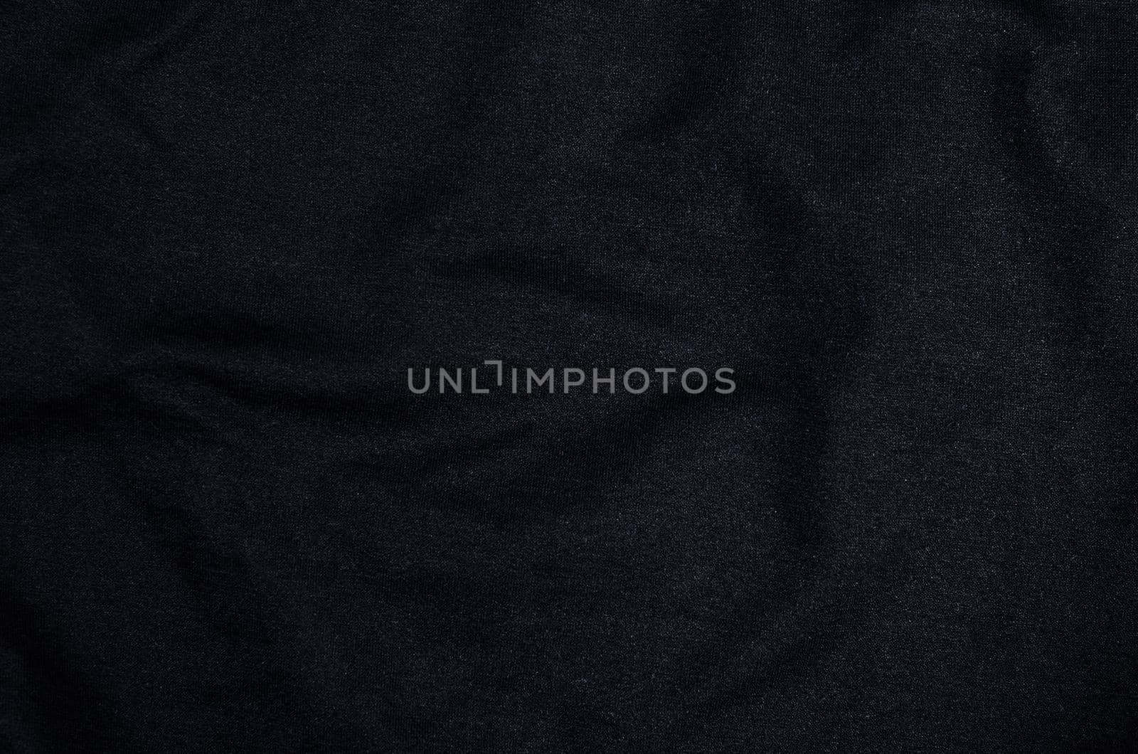 Black fabric textured as background.