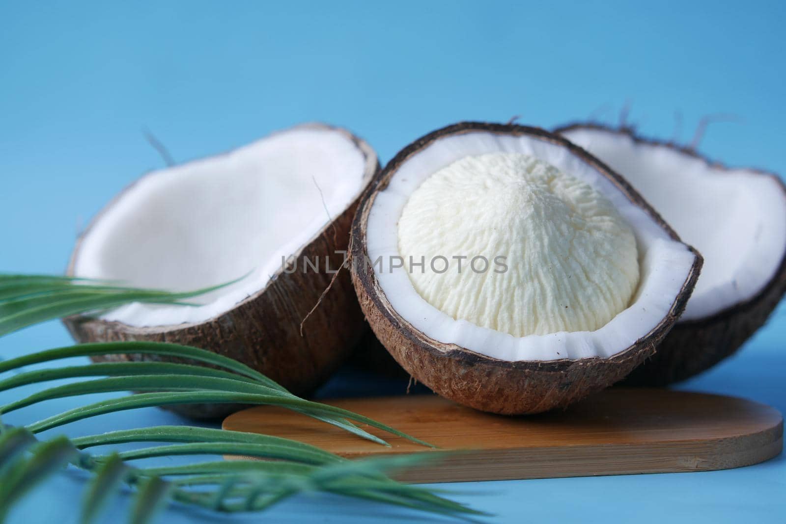 slice of fresh coconut on a table cloth .