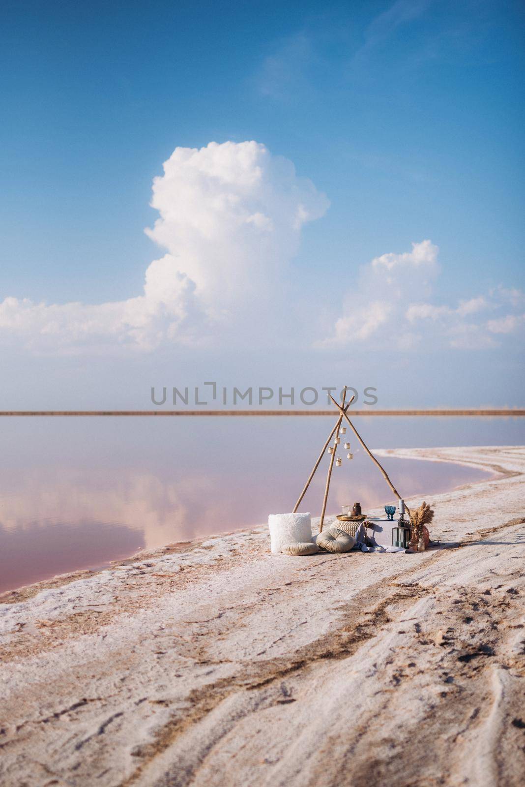 moroccan decor on the shores of a beautiful lake, candles and bungalows