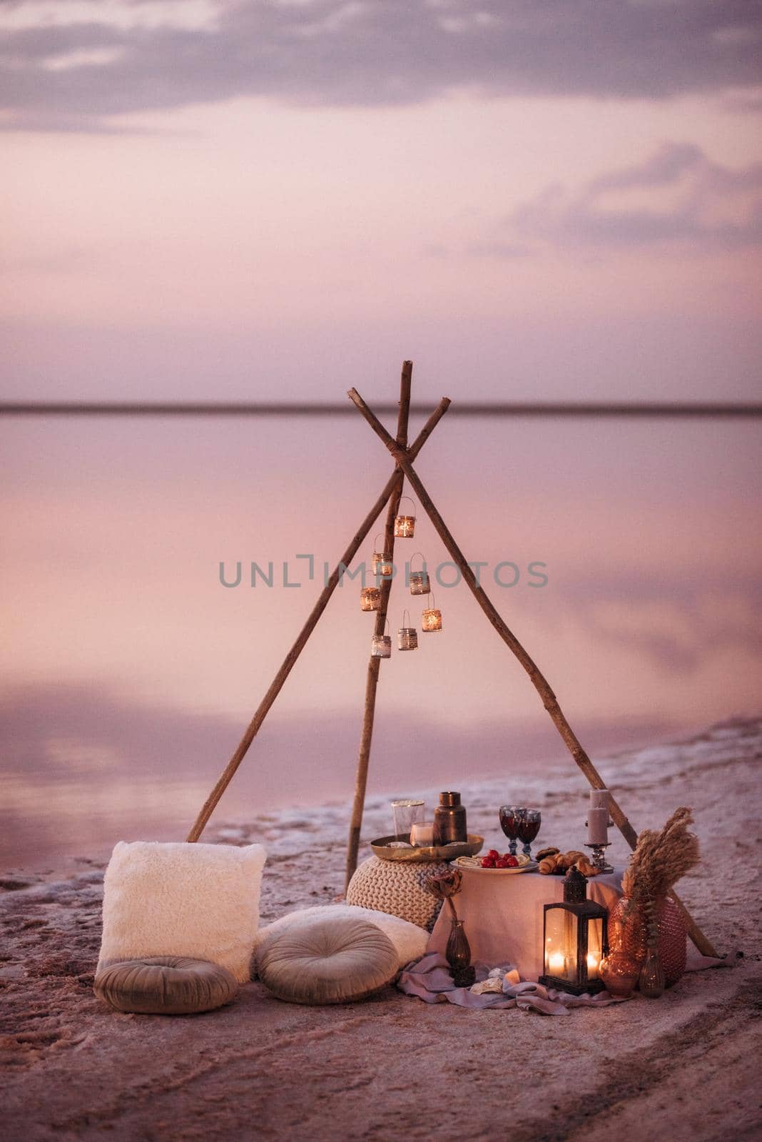 moroccan decor on the shores of a beautiful lake, candles and bungalows