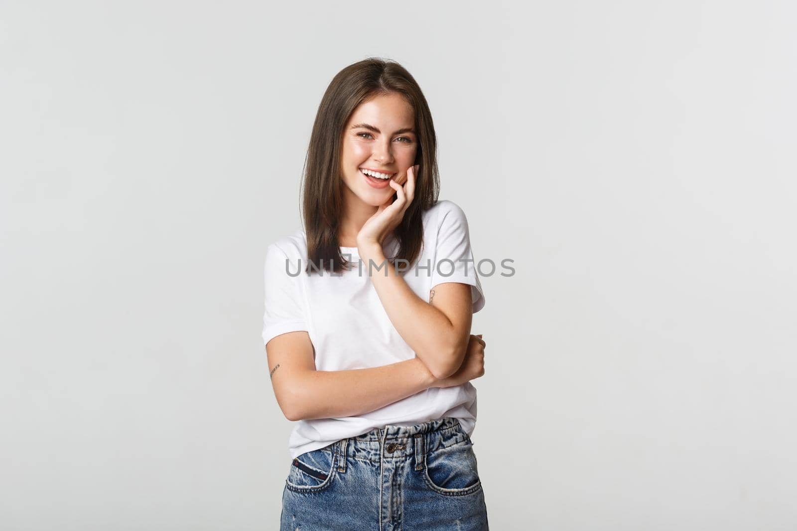 Portrait of attrative coquettish girl laughing silly.