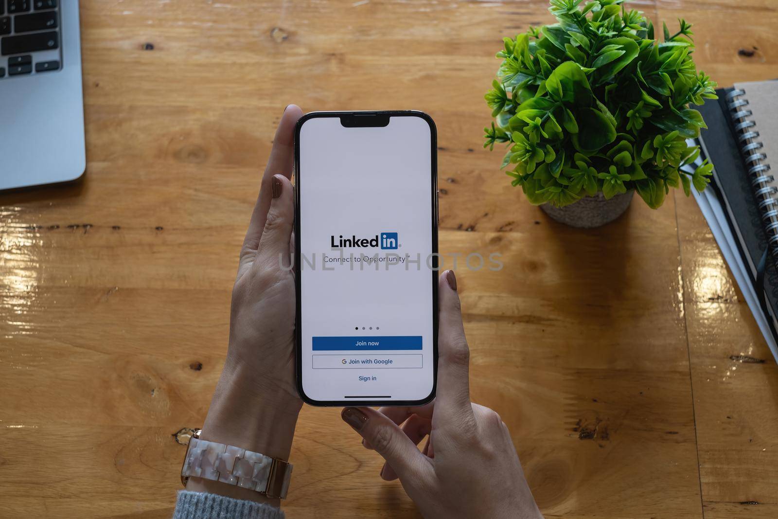 CHIANG MAI, THAILAND: OCT 18, 2021: LinkedIn logo on phone screen. LinkedIn is a social network for search and establishment of business contacts. It is founded in 2002. by itchaznong