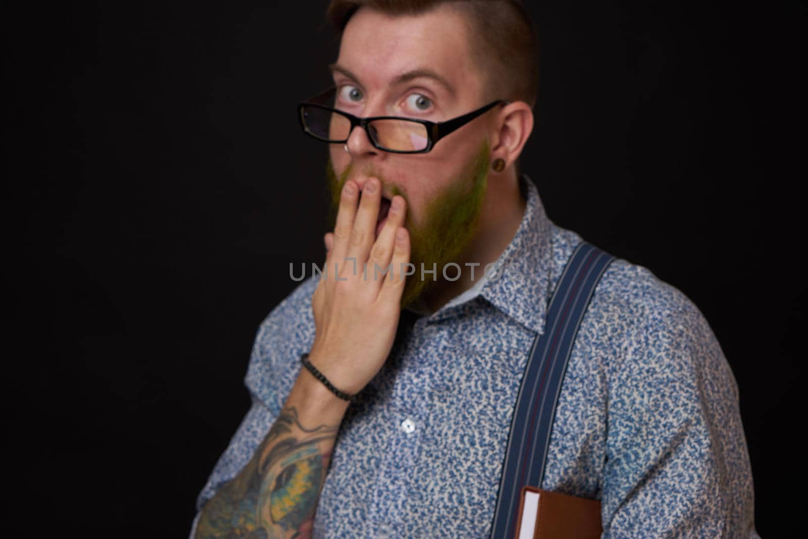 a business man in a shirt with a notebook in the hands of a manager. High quality photo