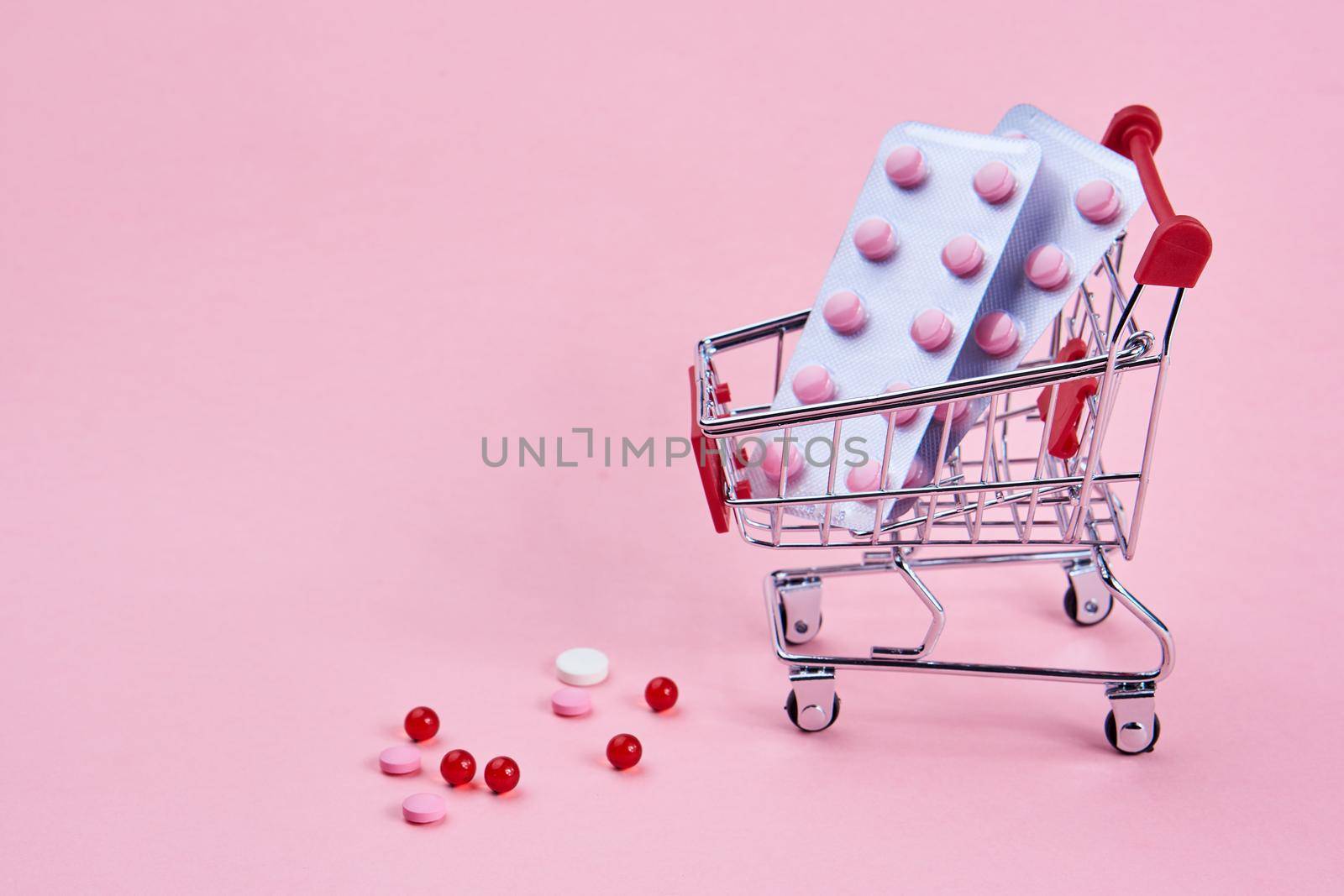 small cart with a pack of drugs pharmacy shopping service medicine. High quality photo