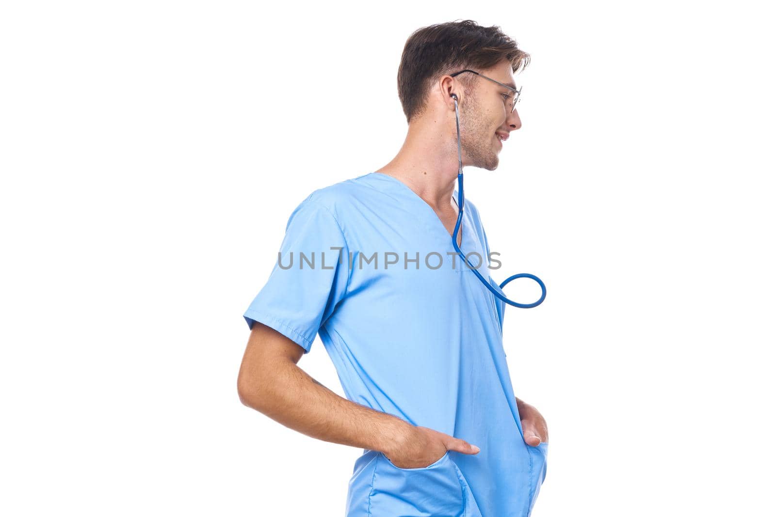 man in medical uniform wearing glasses stethoscope posing light background by Vichizh