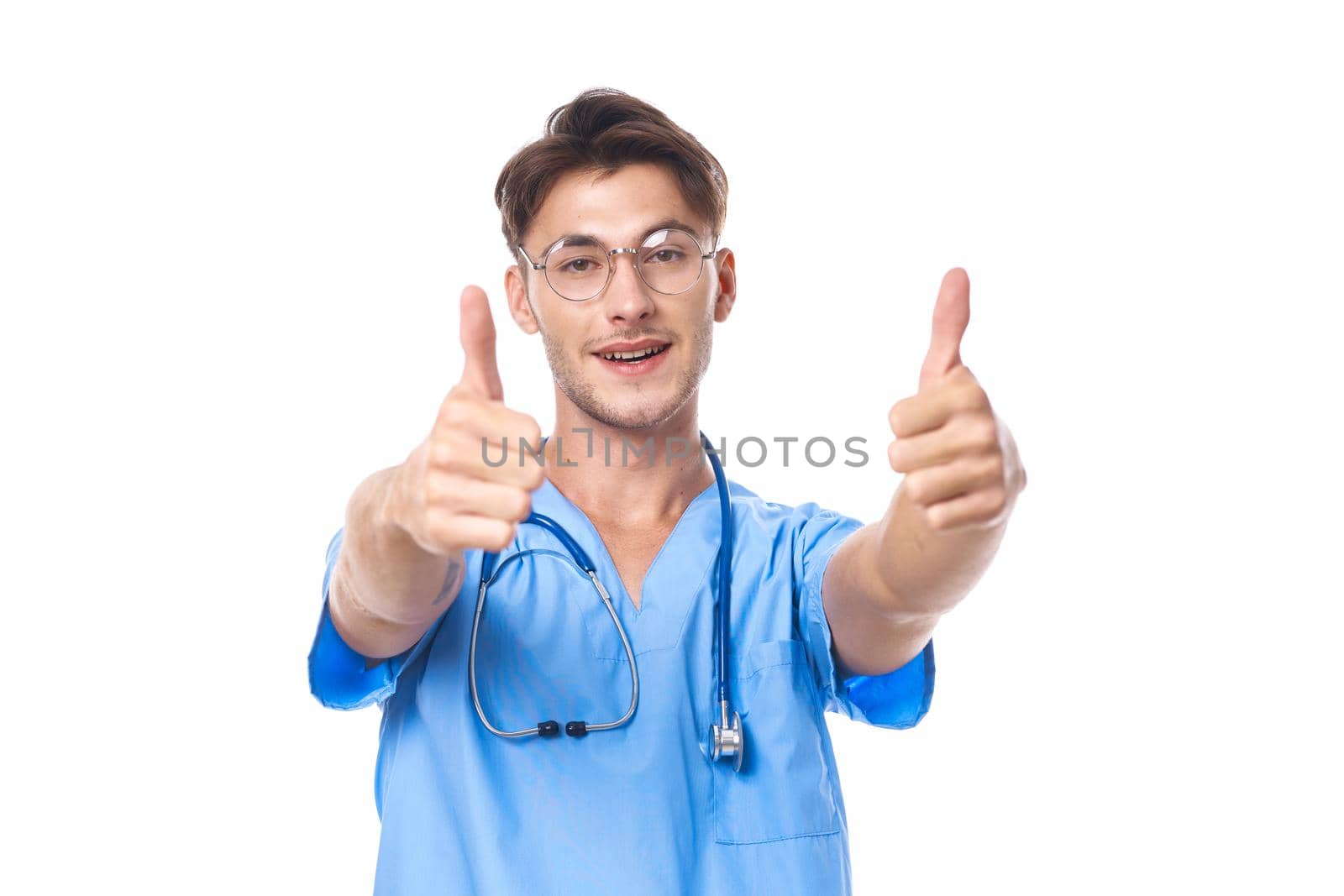 man in medical uniform wearing glasses stethoscope posing light background. High quality photo