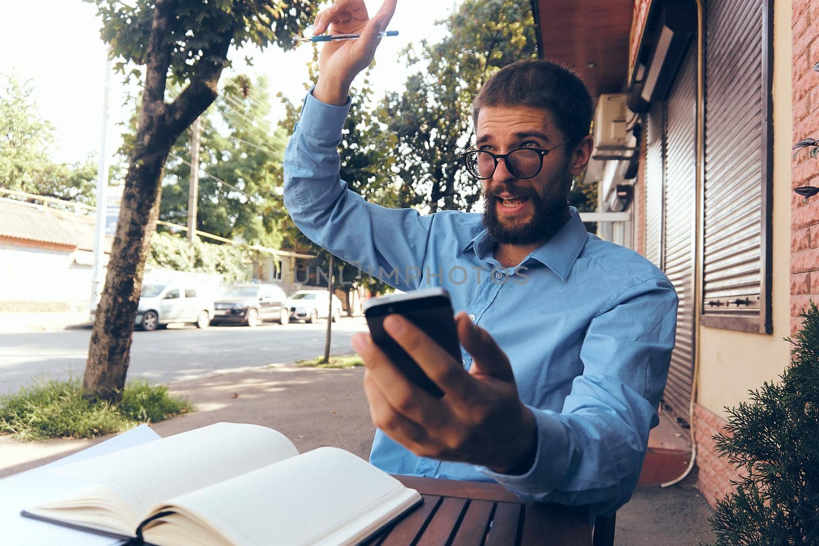 bearded man work documents technology manager in cafe. High quality photo