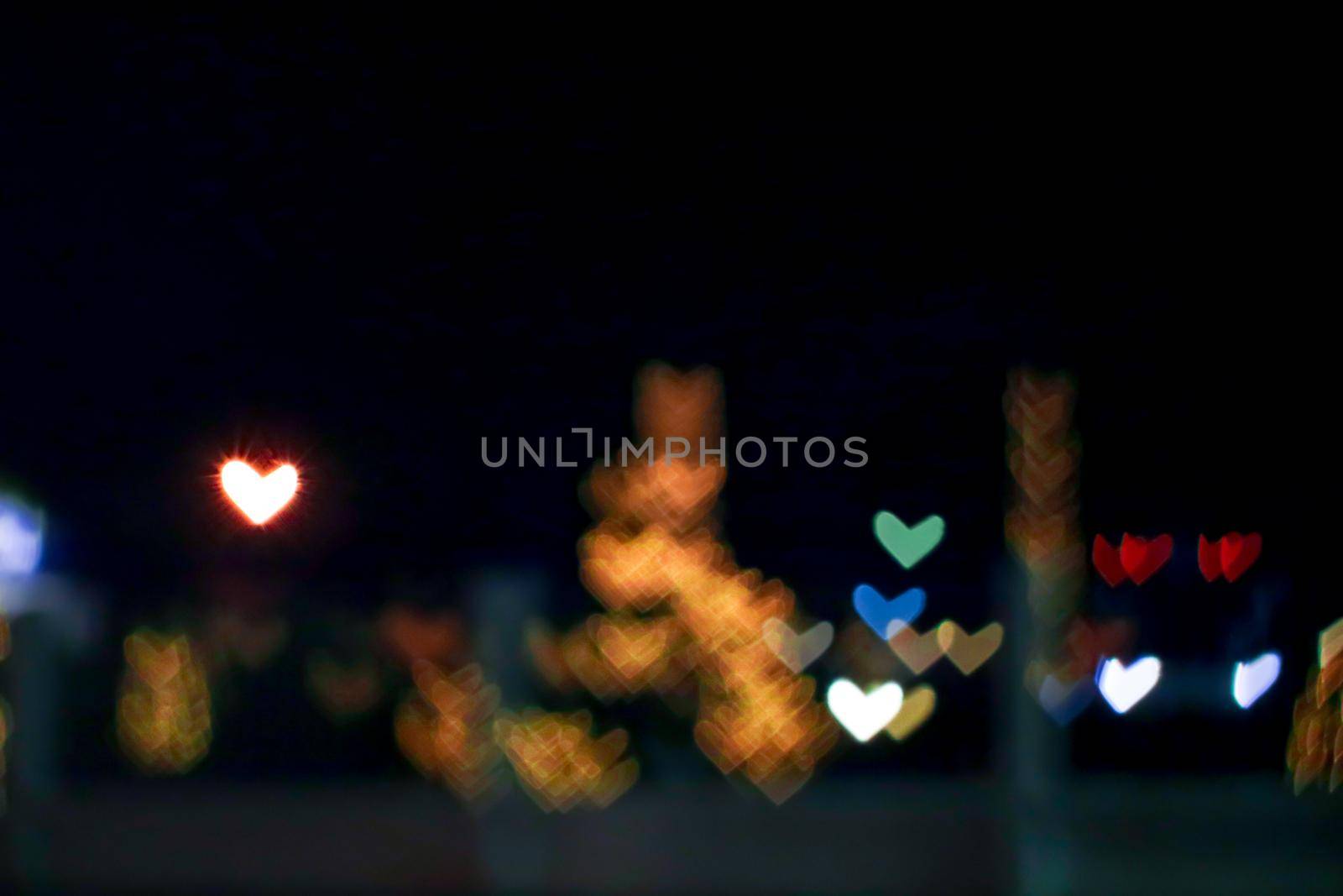 orange bokeh and blur heart shape love valentine day colorful night light on street by Darkfox