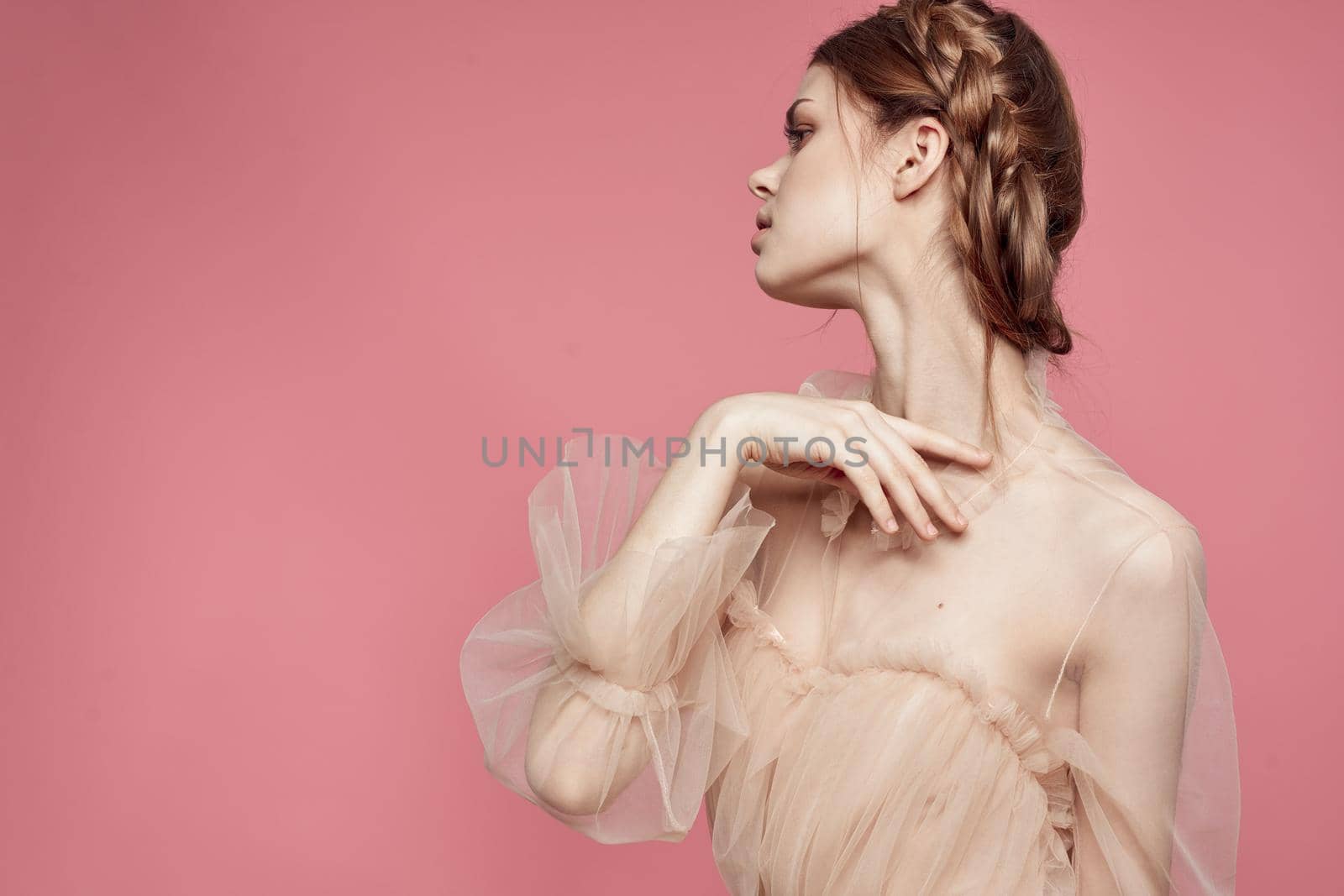 pretty woman hairstyle fun posing cosmetics fashion pink background. High quality photo