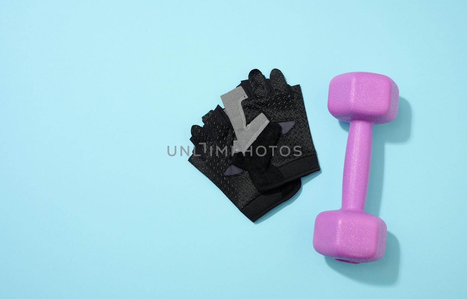 black ports gloves, pair of purple dumbbells on a blue background, healthy lifestyle by ndanko
