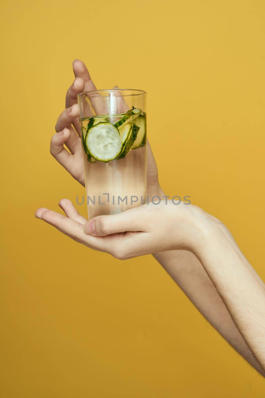 cucumber Fresh vitamins detoxification yellow background. High quality photo