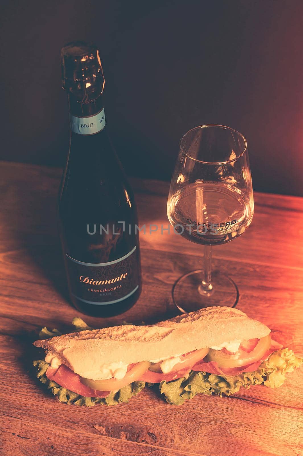 terni.italy october 25 2021:composition prosecco wine and sandwich with a glass