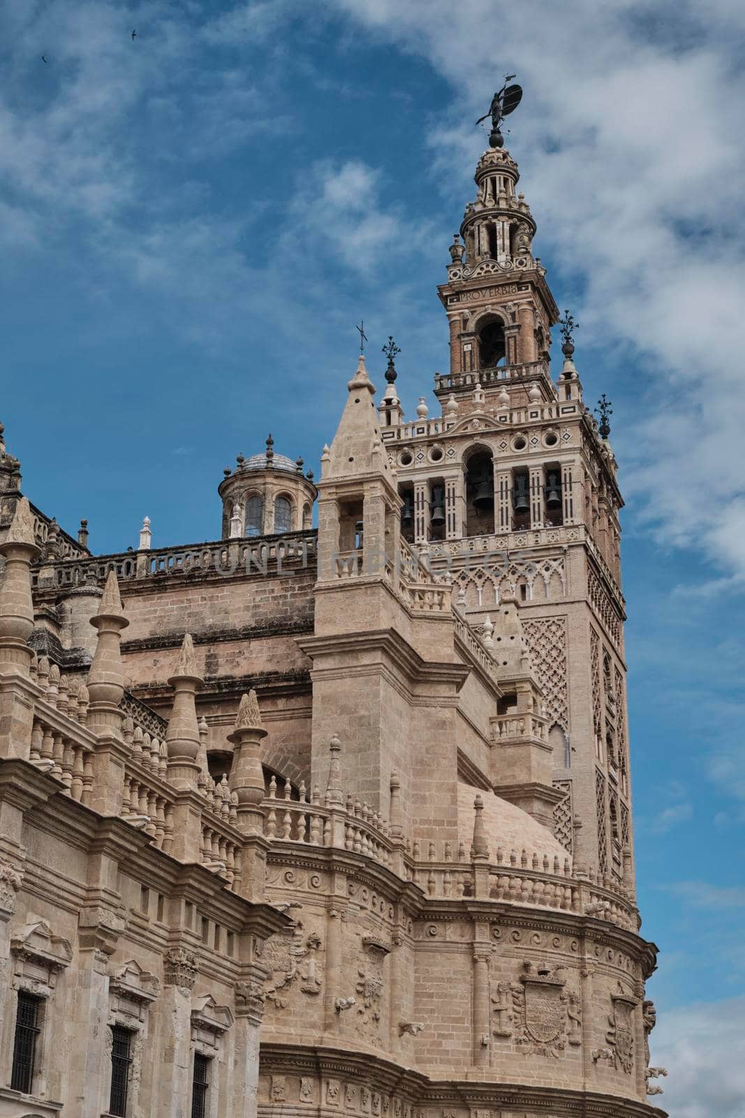 Cathedral of Saint Mary of the See (Seville Cathedral) in Seville, Andalusia, Spain in a sunny and cloudy day