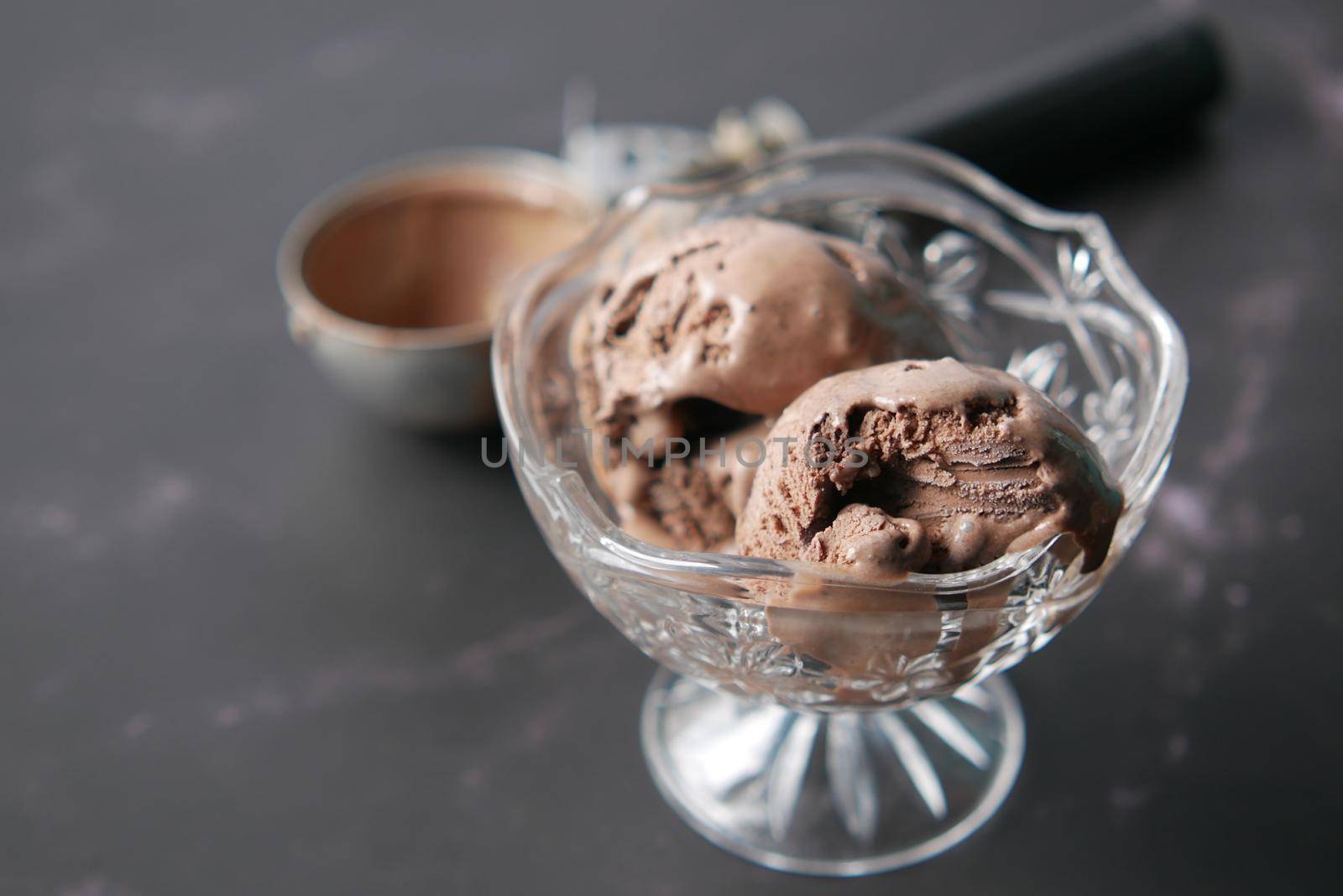 close up of vanila flavor ice cream in a container .