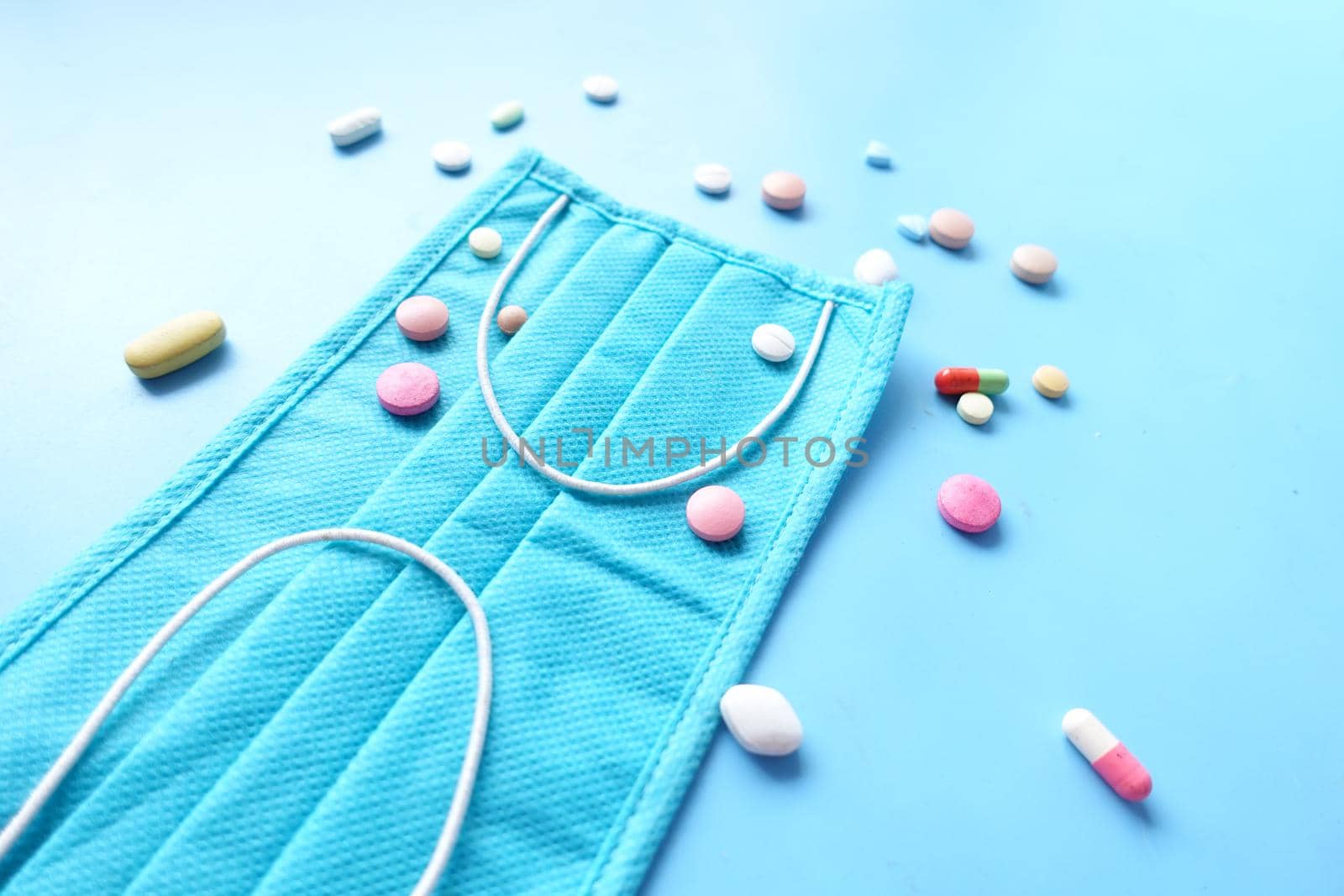 Close up of blue surgical masks on table.