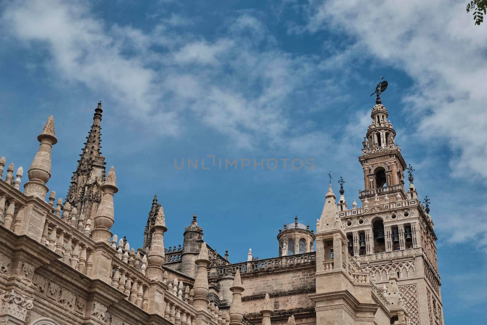 Cathedral of Saint Mary of the See (Seville Cathedral) in Seville, Andalusia, Spain in a sunny and cloudy day