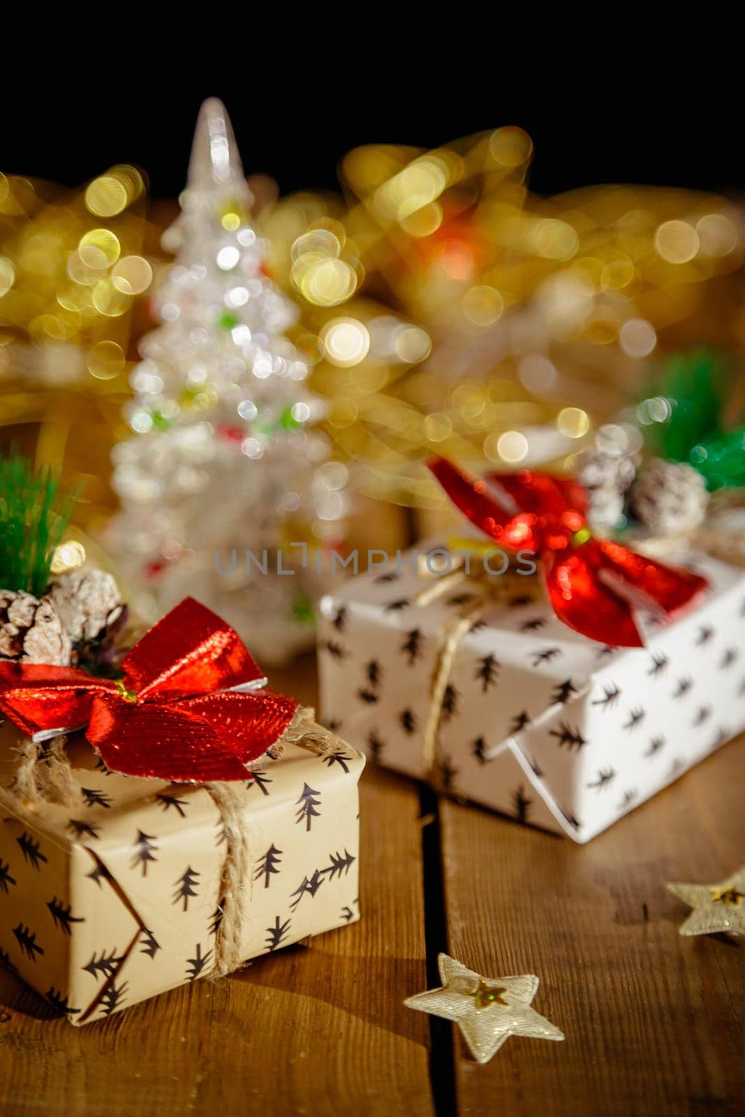 Christmas New Year's boxes with gifts. Yellow garland and decorative stars.