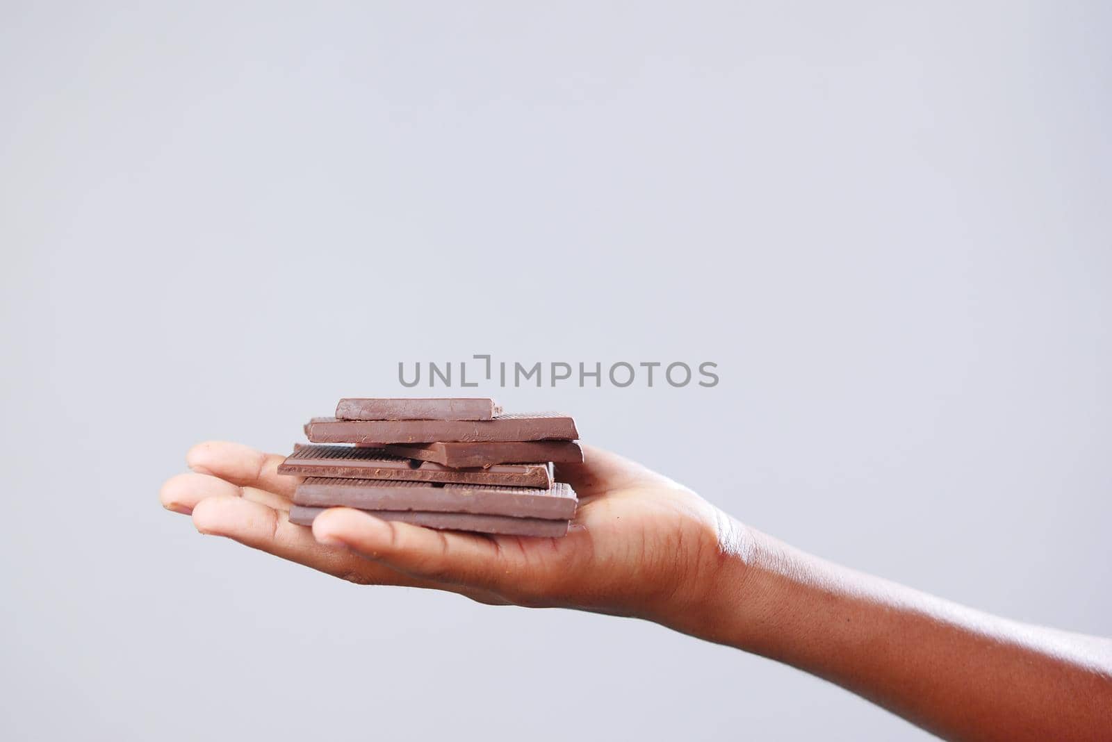 dark chocolate on a plate on table close up .