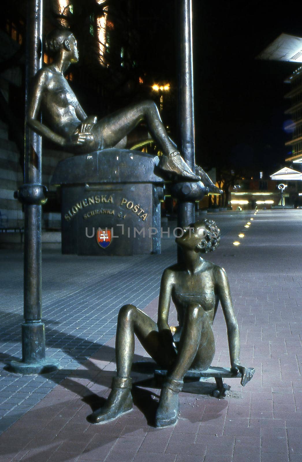 Post box statues in Bratislava Slovakia at night by VivacityImages