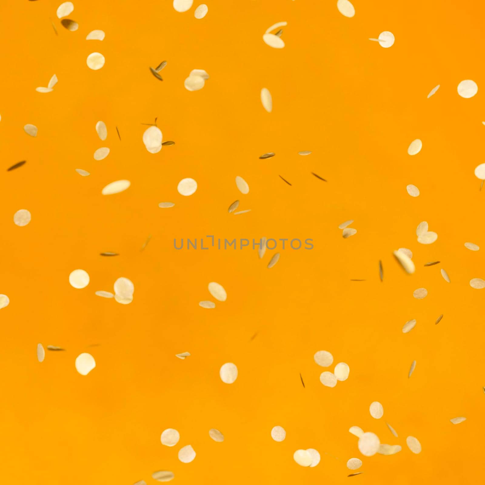 arrangement golden party confetti orange wall. High resolution photo