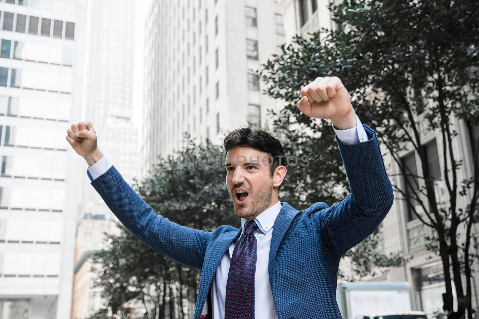 businessman celebrating success street. High resolution photo