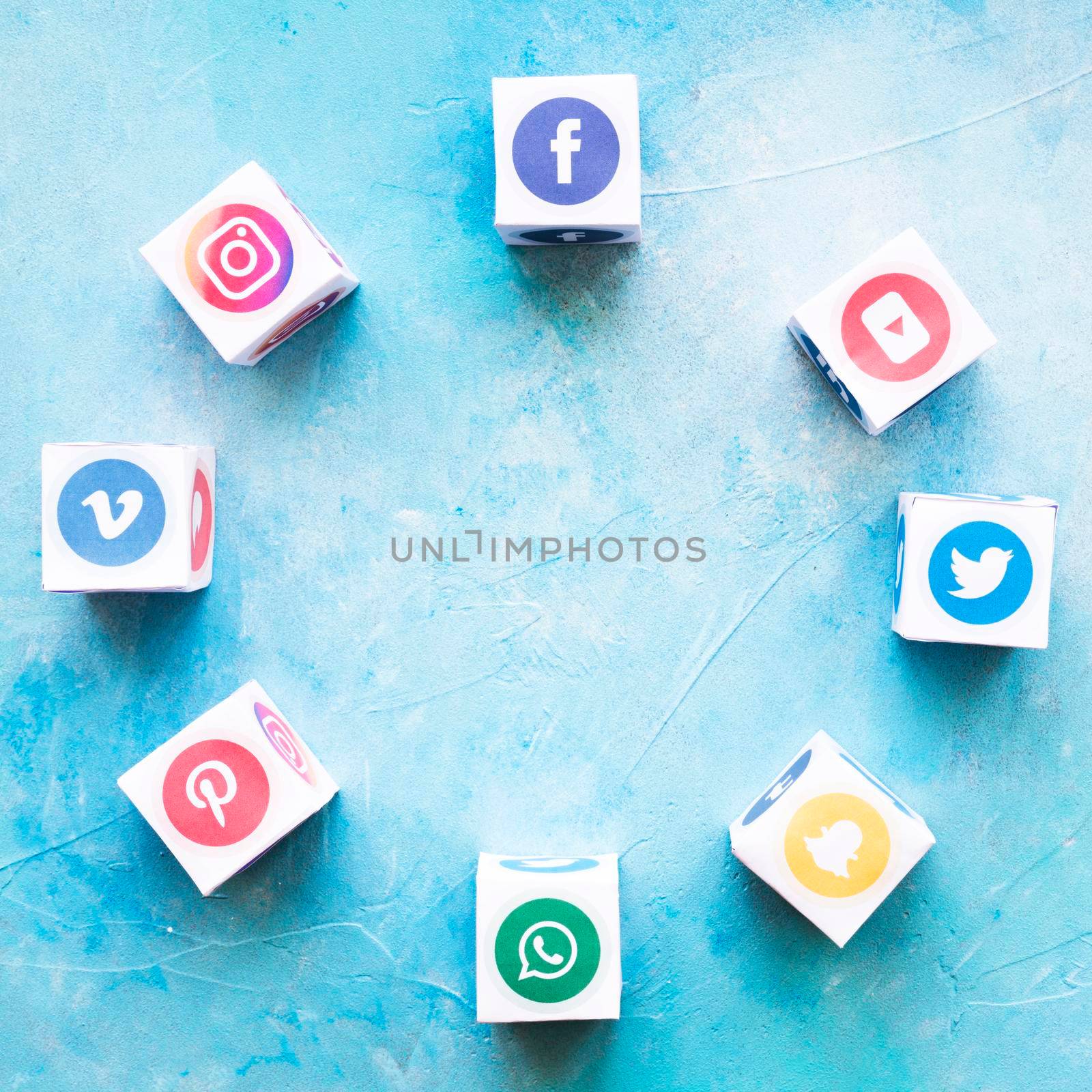 blocks social media icons arranged circular shape textured background. High resolution photo