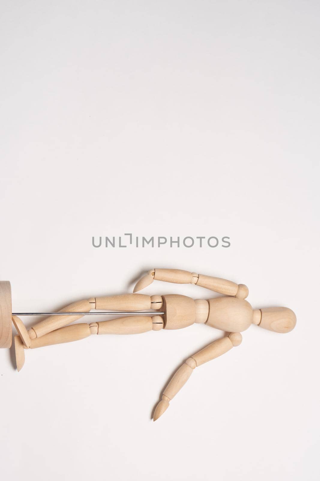 wooden mannequin object close up light background. High quality photo