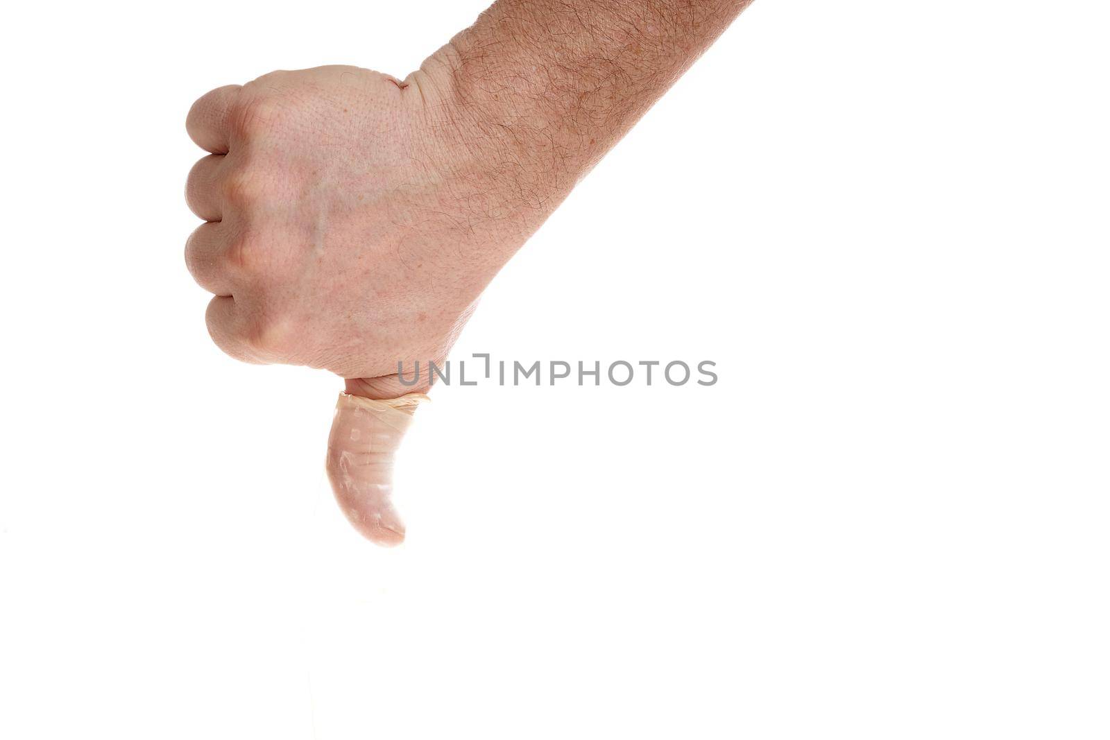 Hand holds a condom on a white background, a template for designers. Close up