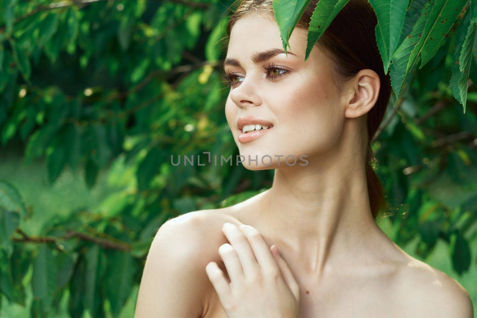 pretty woman Cosmetology nature green leaves glamor cropped view. High quality photo