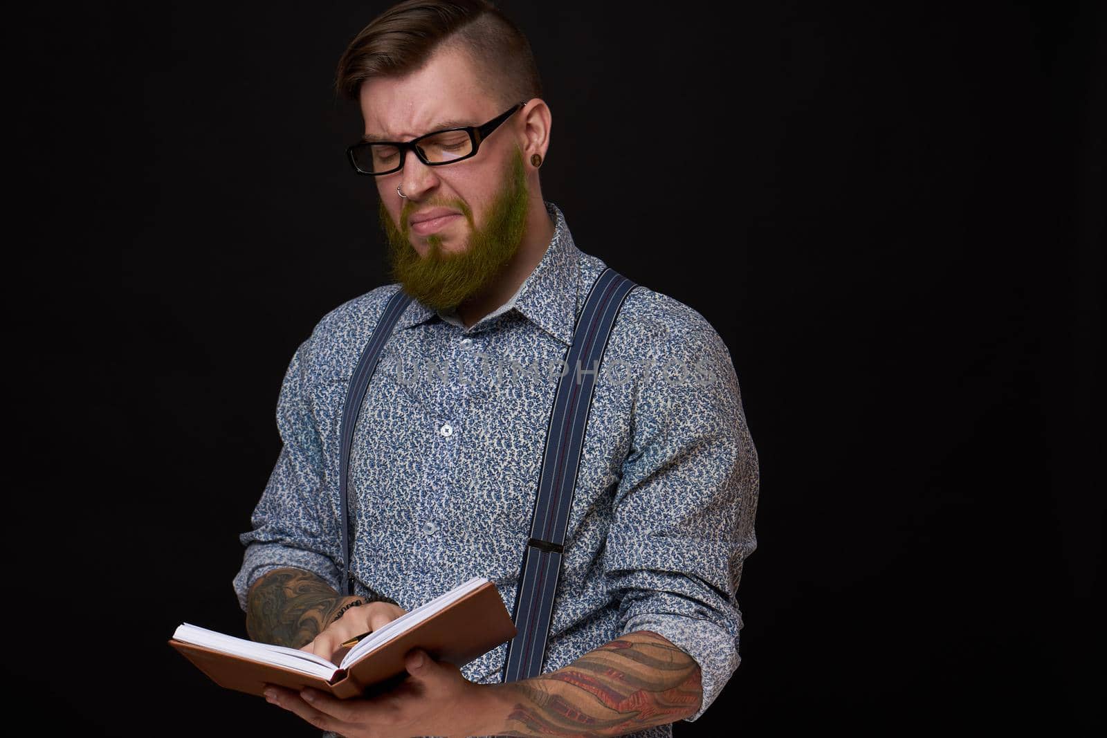 a business man in a shirt with a notebook in the hands of a manager. High quality photo