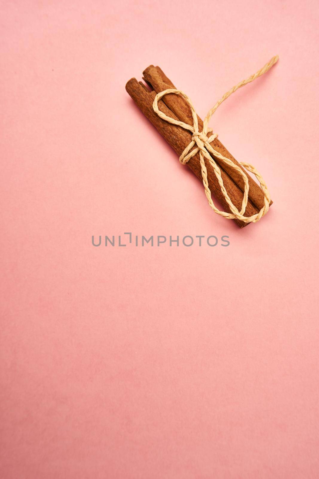 flowers decoration cinnamon pink background top view. High quality photo