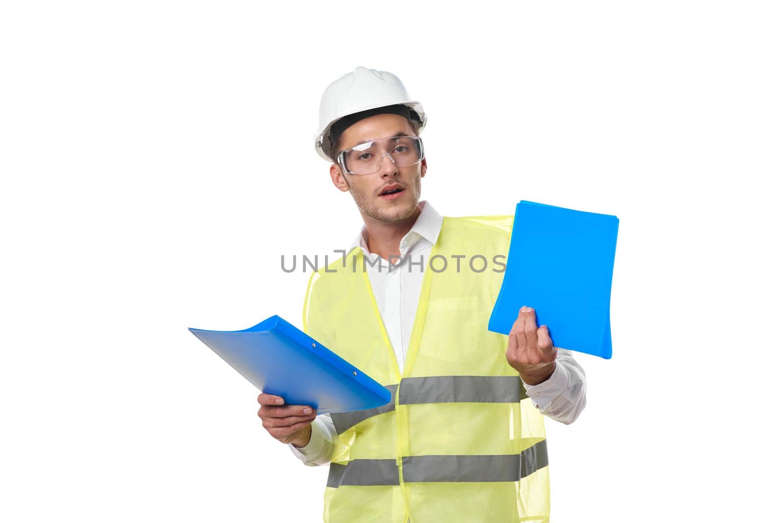 engineer in working uniform protective clothing documents construction by Vichizh