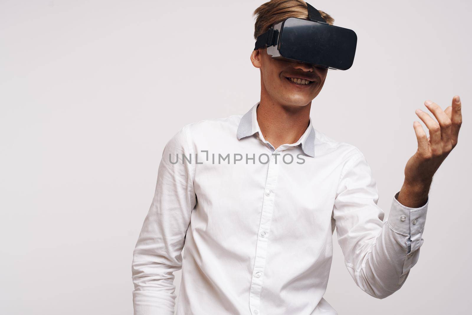 pretty man in a white shirt vr glasses gadget device video isolated background by Vichizh