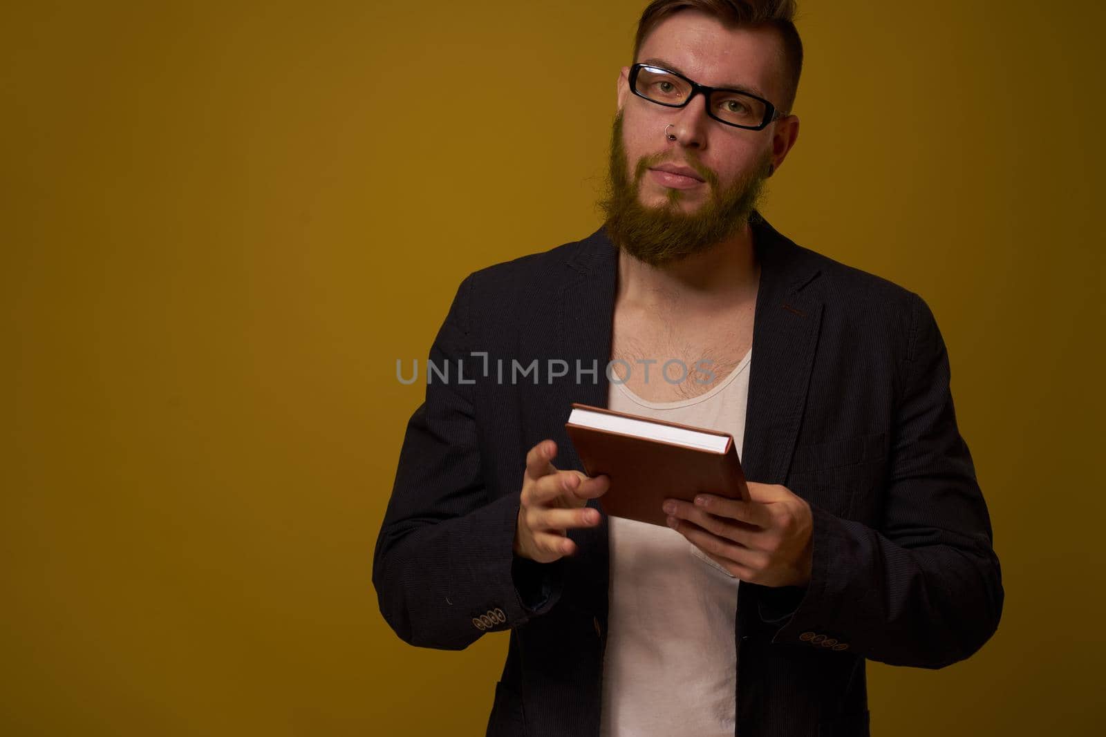 business man with glasses notepad in the hands of a studio official. High quality photo