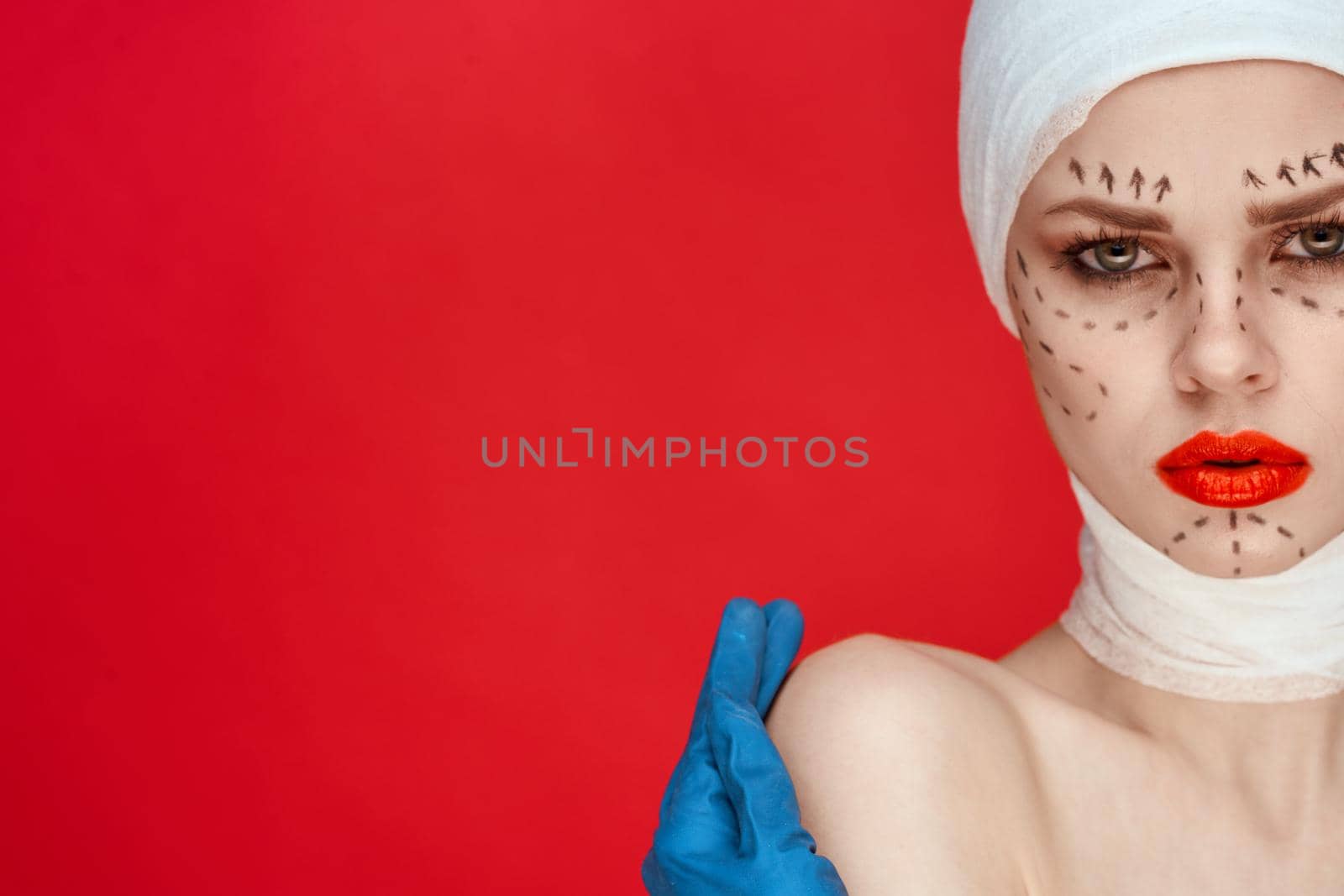portrait of a woman Red lips plastic surgery operation bare shoulders isolated background. High quality photo